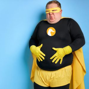 comical fat superhero man has stomach ache